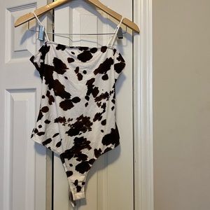 NWT. cow print bodysuit